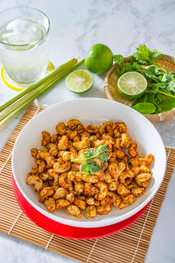 thai tom yum cashews in a white bowl