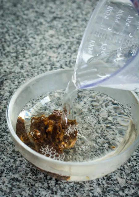 soaking tamarind paste in warm water