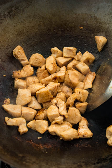stir fried chicken in a wok