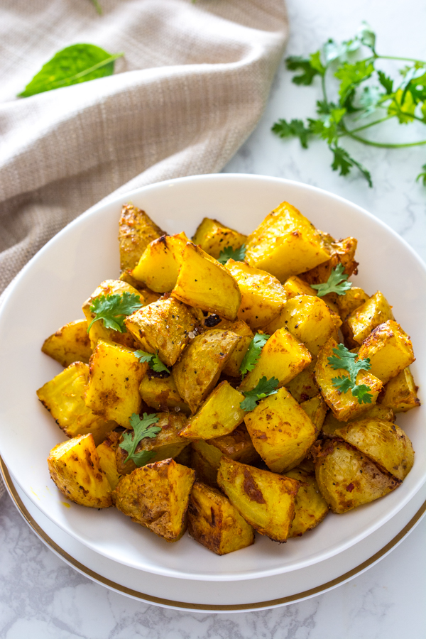 Roasted Thai Yellow Curry Roasted Potatoes on white plate