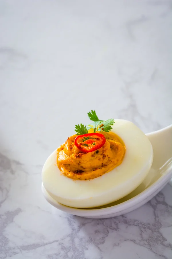 Thai Red Curry Deviled Egg on spoon