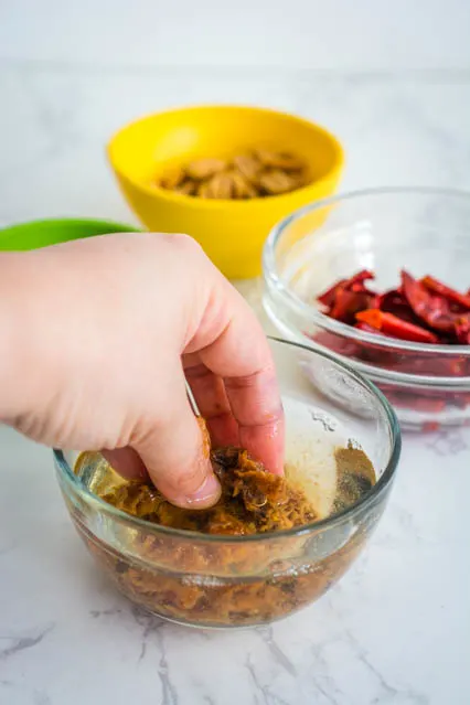 squeezing tamarind paste