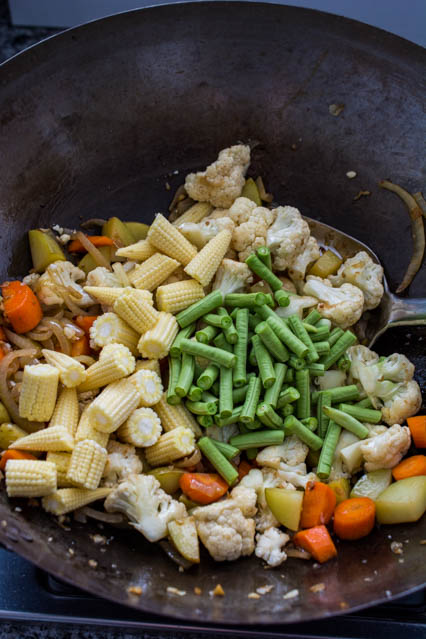 vegetables in a wok for thai yellow curry