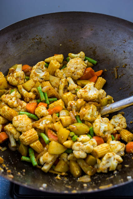 thai yellow curry with vegetables in wok