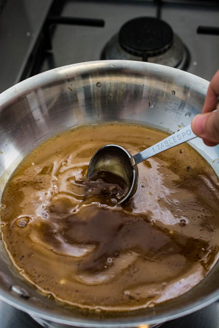 stirring sauce in saucepan