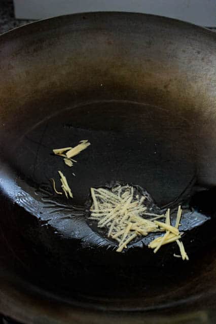 julienned ginger in wok