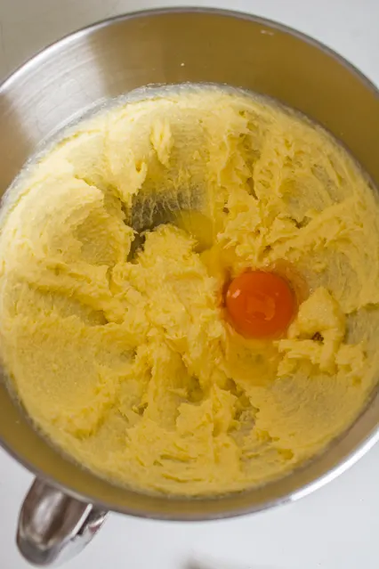 creamed butter with egg in mixing bowl
