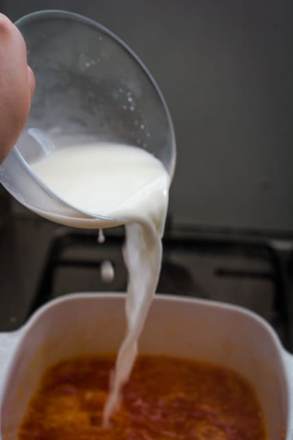 pouring cornstarch into sweet chili sauce