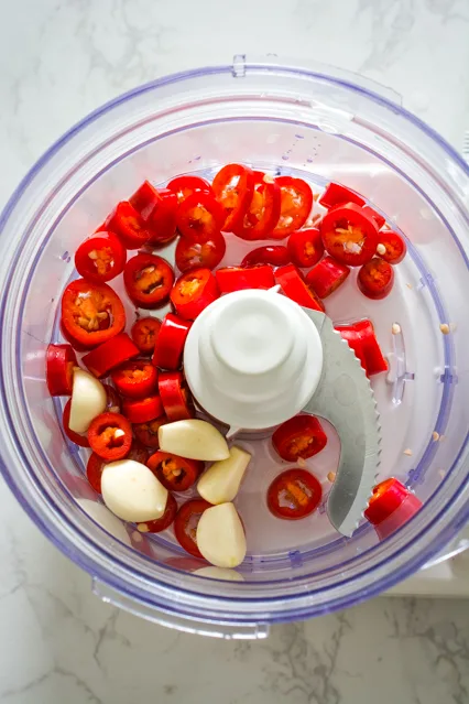 sliced red chili and garlic in food processor