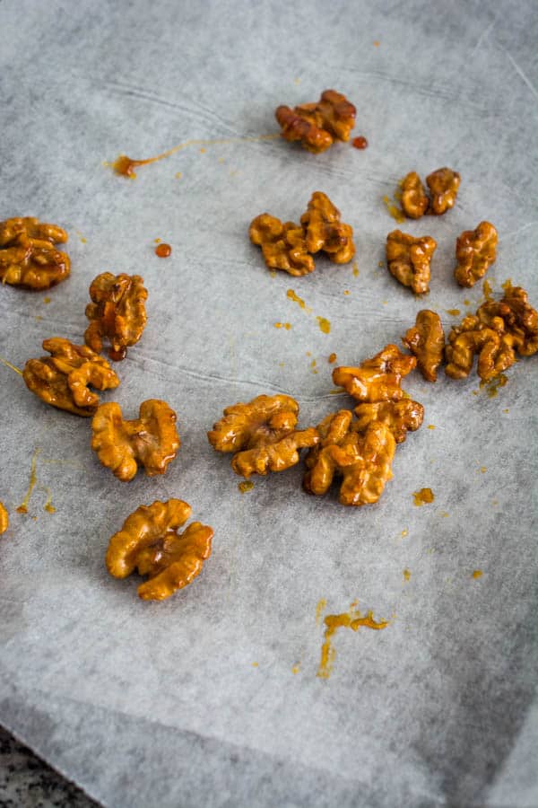 candied walnuts on parchment paper