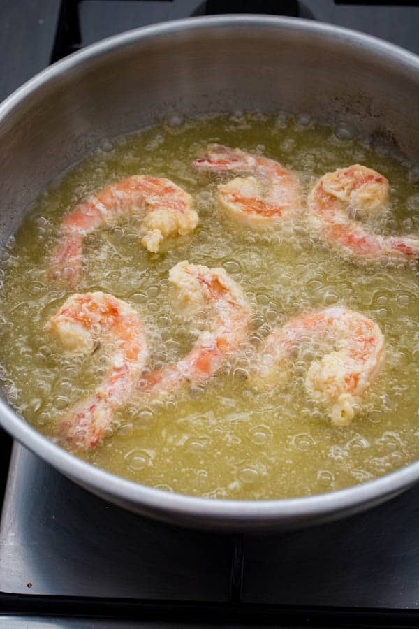 frying shrimp in saucepan