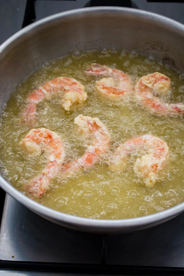 frying shrimp in saucepan