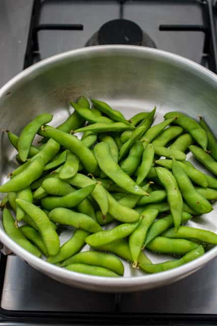 edamame pods in frying pan