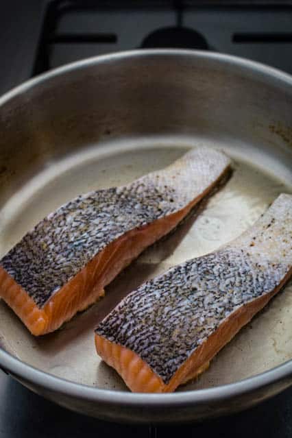 pan-fried salmon in frying pan