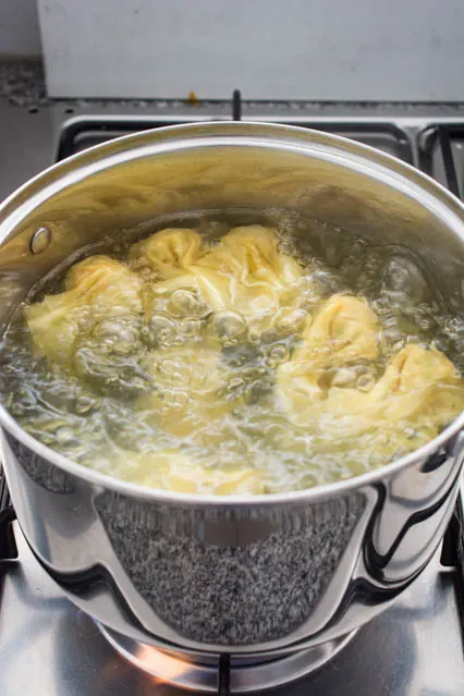 cooked wontons in boiling water