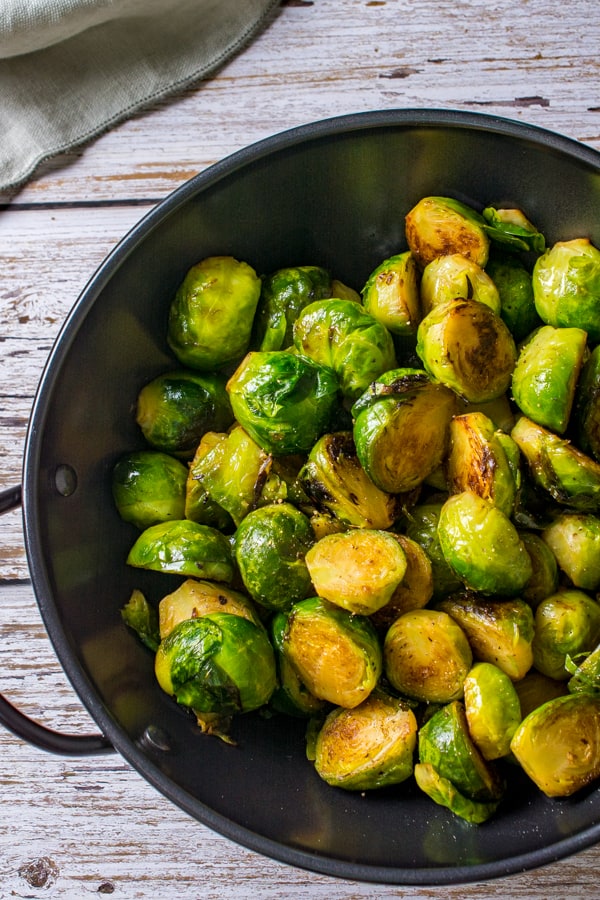 Stir-fried Brussels sprouts in a wok
