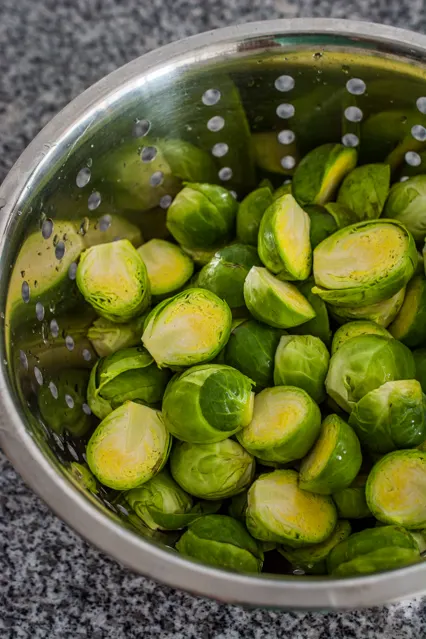 rinsed Brussels sprouts in a colander
