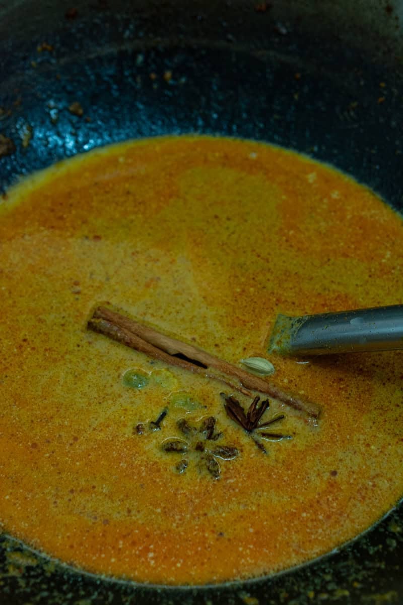 curry with spices in a wok