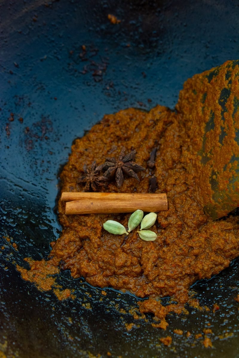 spice paste, with cinnamon stick, star anise, cloves, and cardamom pods
