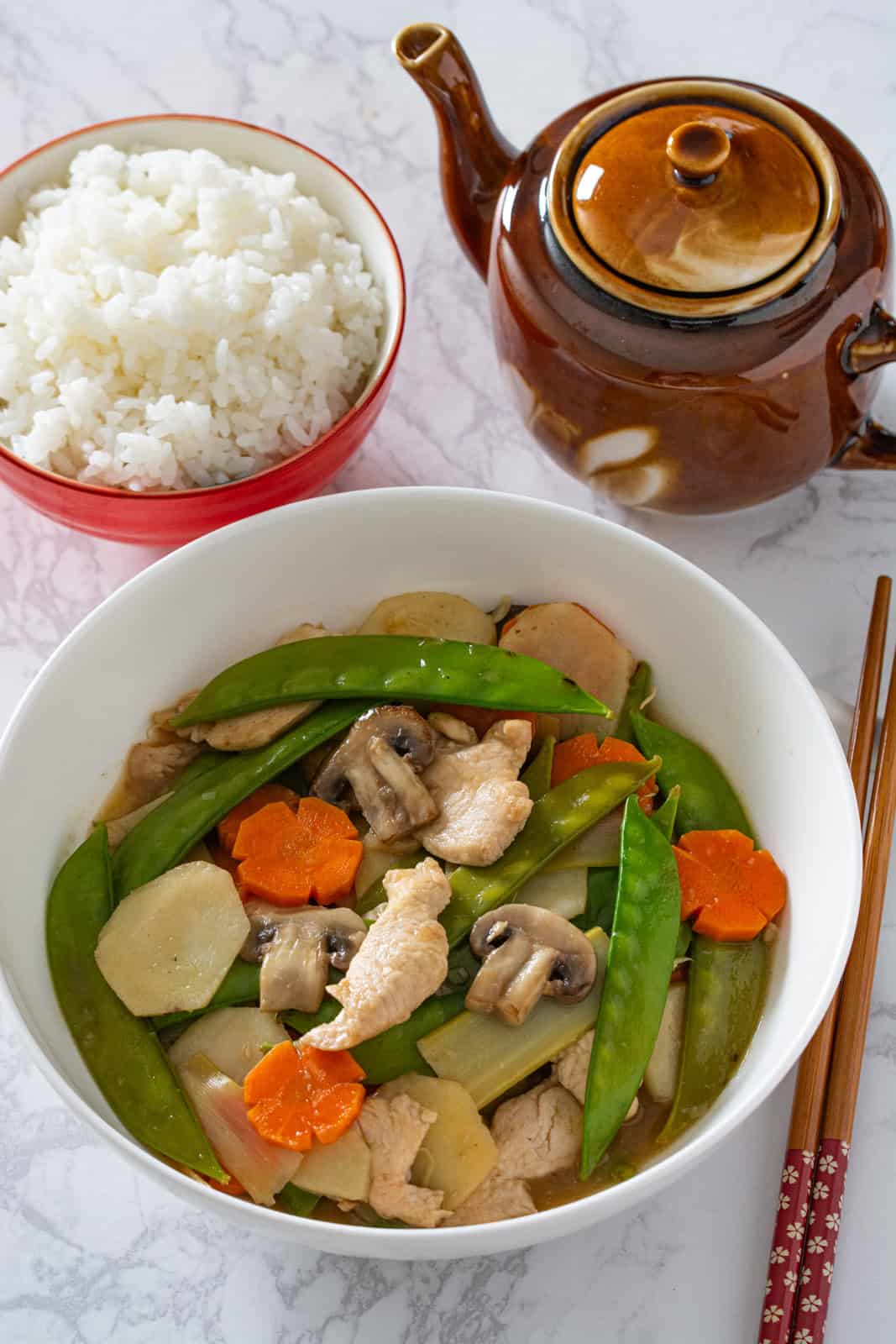 moo goo gai pain in a bowl with steamed rice