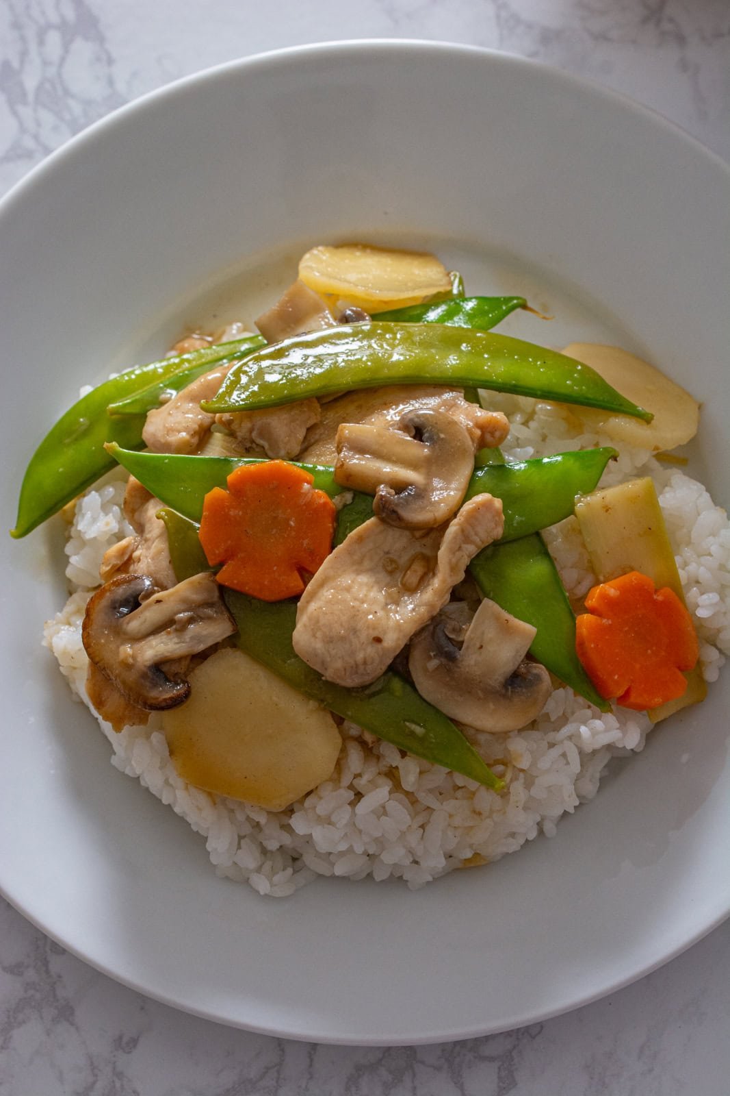 moo goo gai pan on steamed rice
