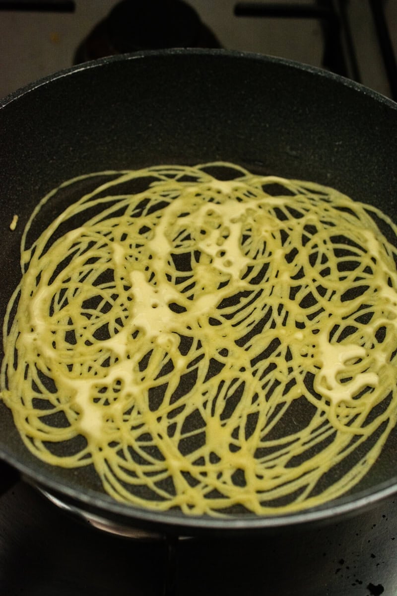 roti jala in a small pan