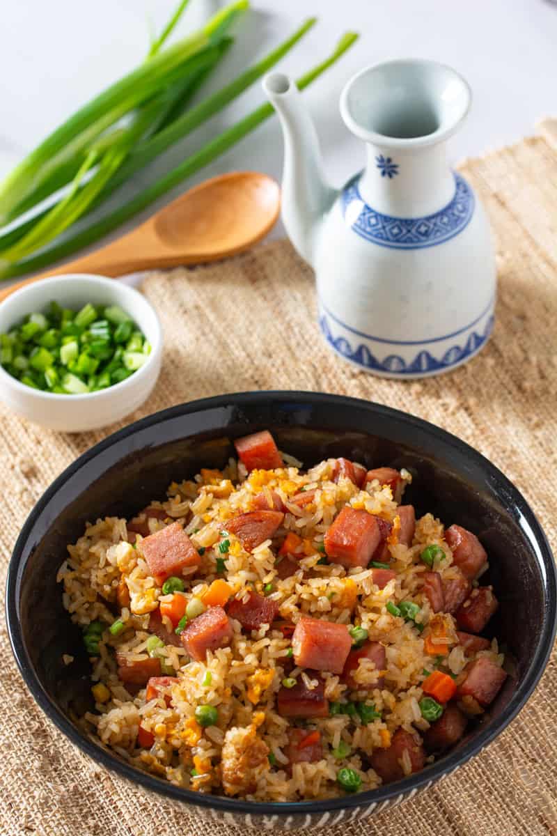 spam fried rice in a black bowl