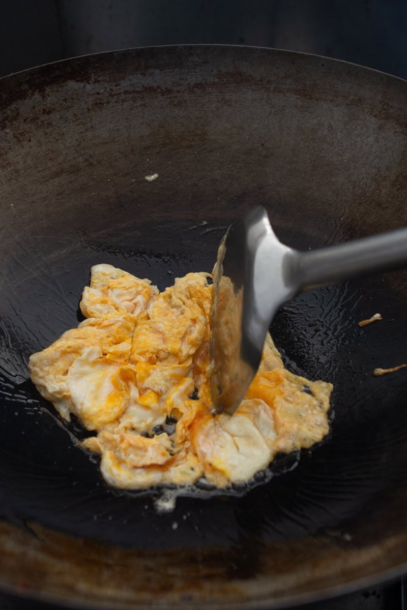 scrambling eggs in a wok