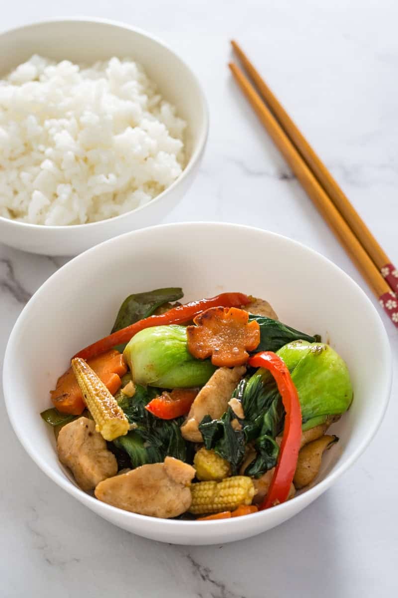 stir fry chicken with a bowl of rice