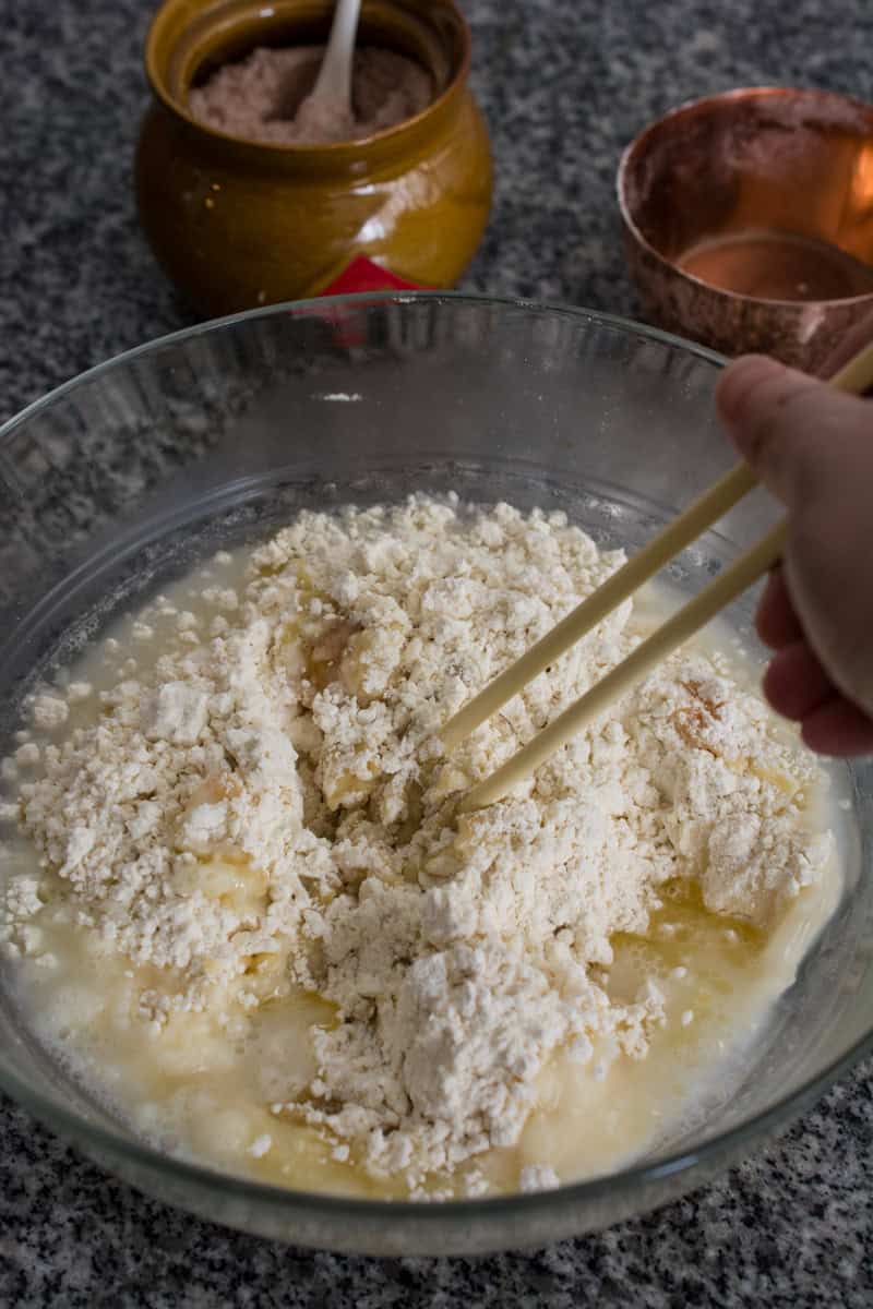 combining dough mixture with chopsticks